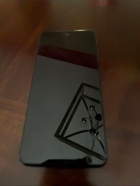 Motorola bluish grey Smartphone with Dark Teal Display